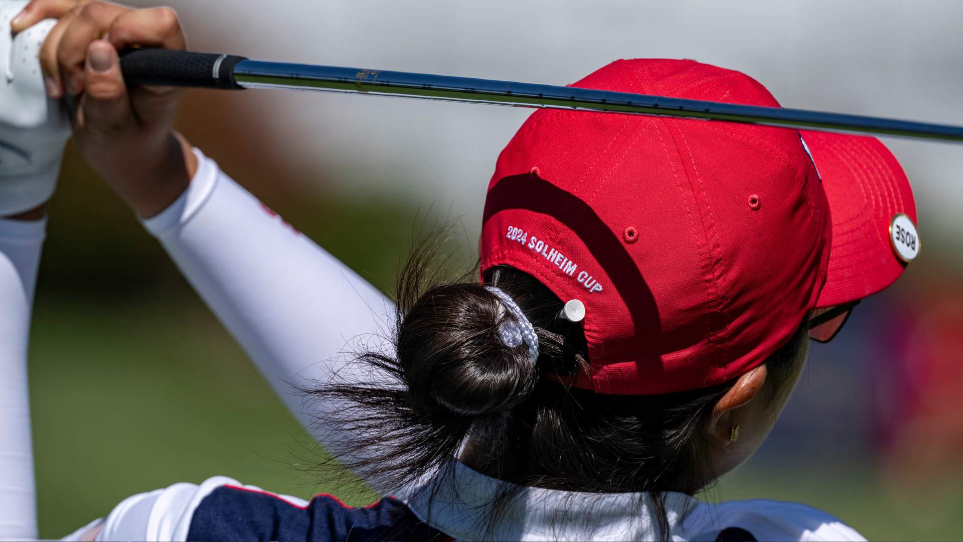 Woman playing with a red cap