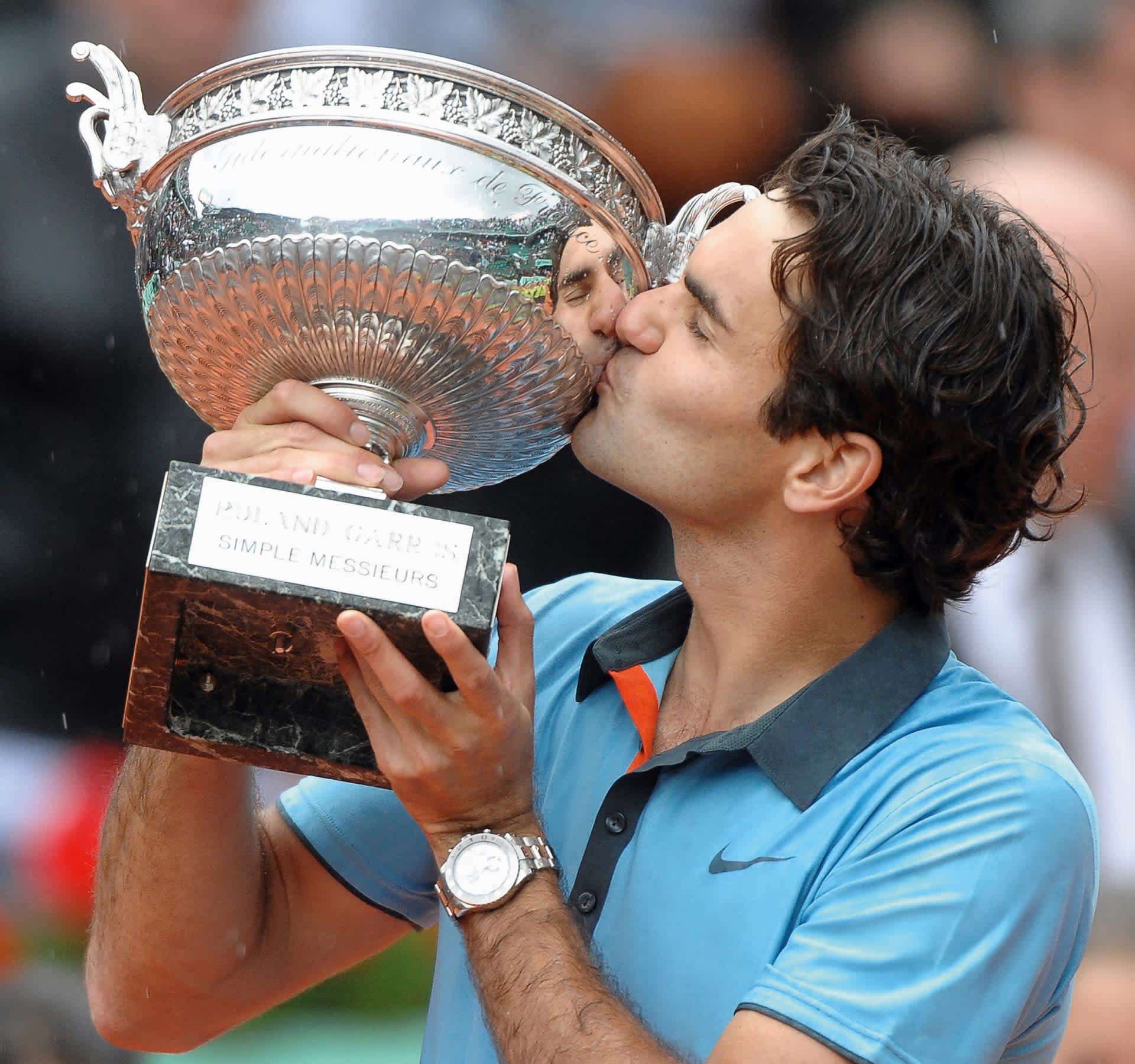 Roger Federer after winning Wimbledon, wearing a Rolex Cosmograph Daytona