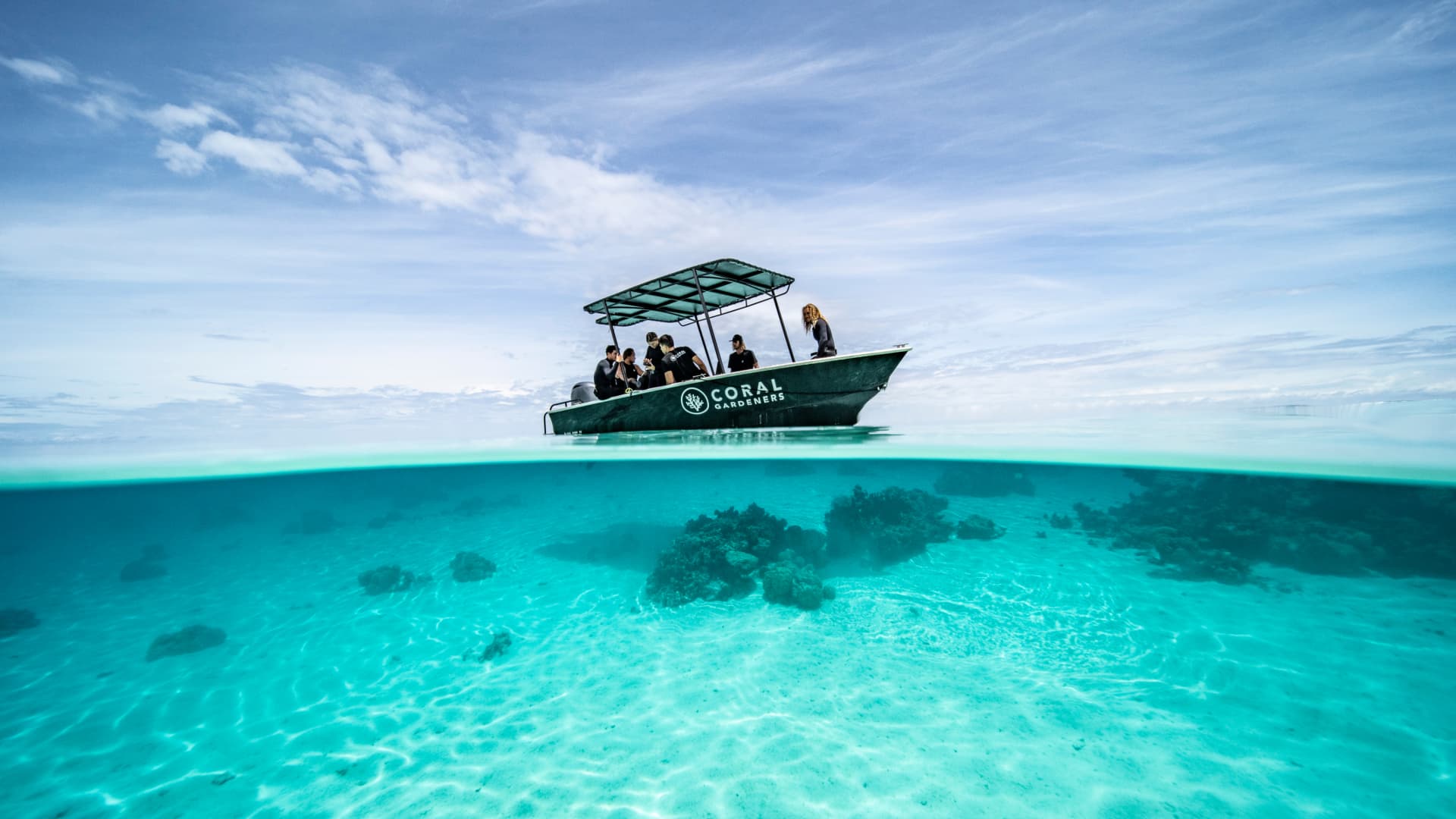 Titouan Bernicot with his "coral gardeners" team on the boat