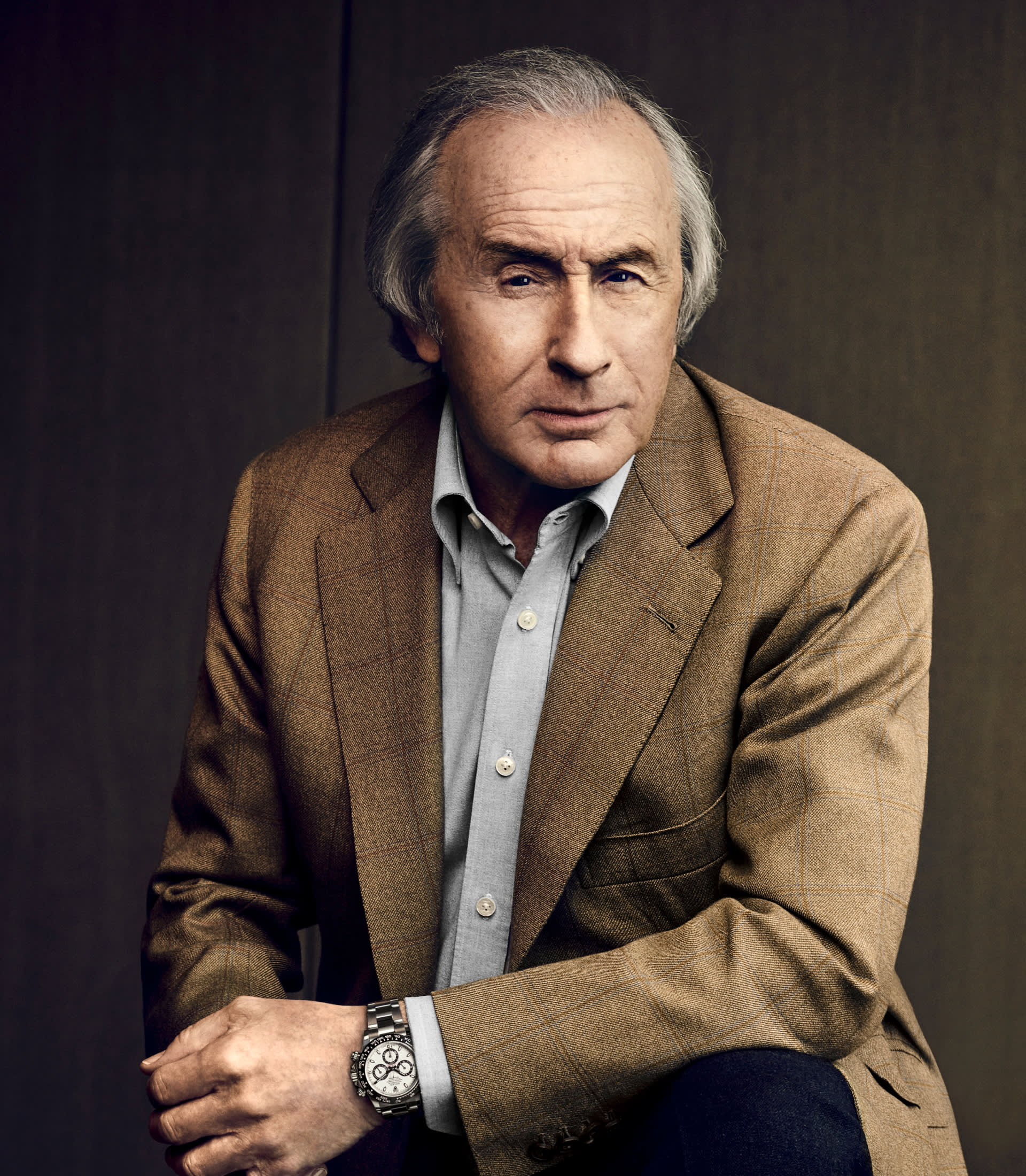 Jackie Stewart wearing a Rolex Cosmograph Daytona