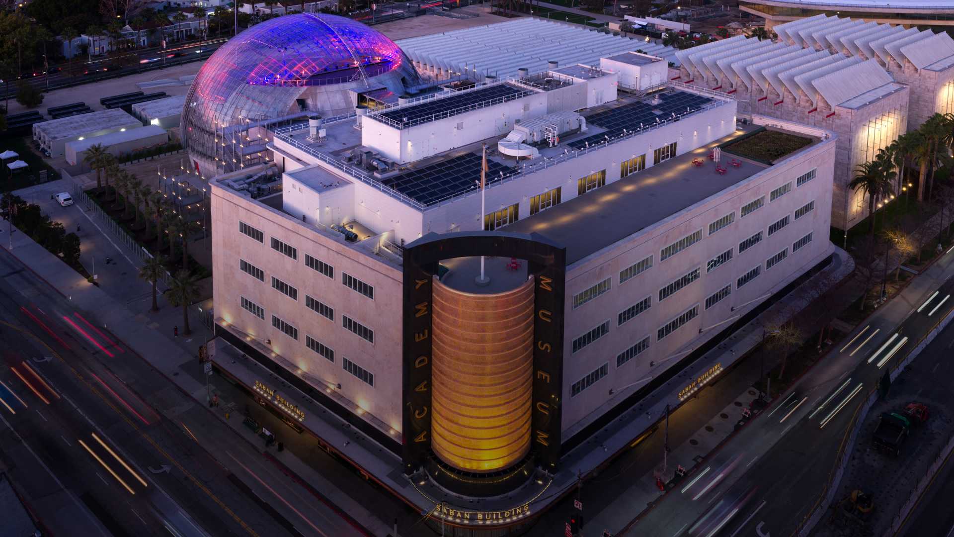 Academy Museum of Motion Pictures illuminated at night
